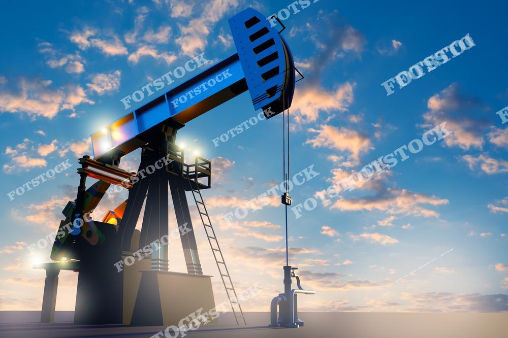 На фотографии изображена нефтяная качалка, работающая на фоне яркого заката и облачного неба. Солнечный свет подчеркивает детали конструкции и символизирует динамичность нефтяной индустрии. Изображение акцентирует внимание на значении технологий в добыче ресурсов.